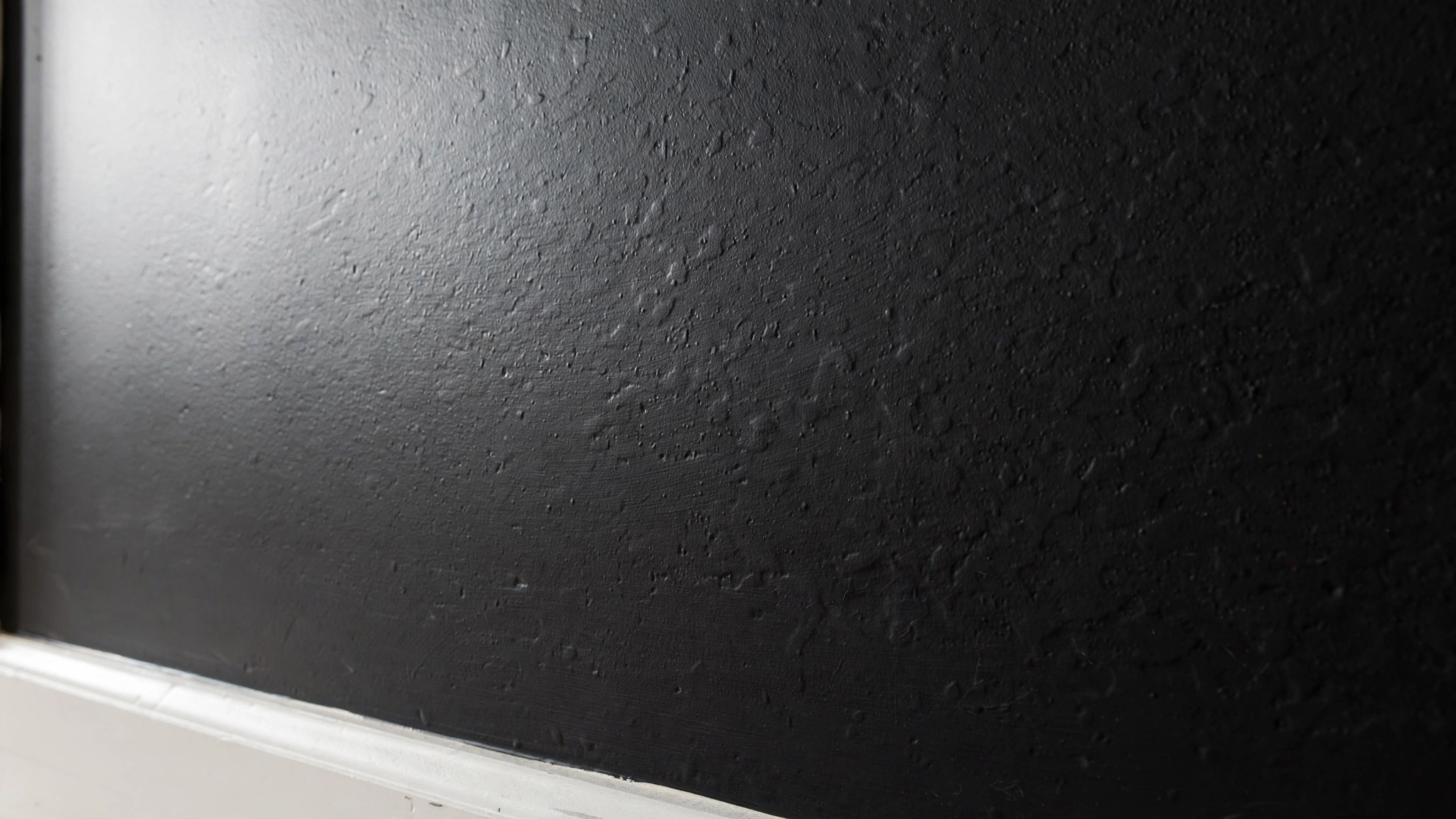 Eggshell black painted bedroom wall, soft durable finish